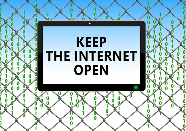 Tablet in front of fence with words that read, keep the Internet open for a blog post about how the end of net neutrality will affect content writers