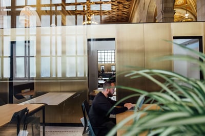 Man sitting at a computer in an office