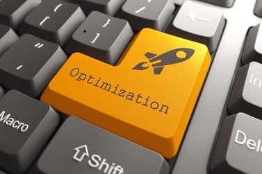 Orange key on a keyboard showing the word Optimization and the shape of a rocket ship
