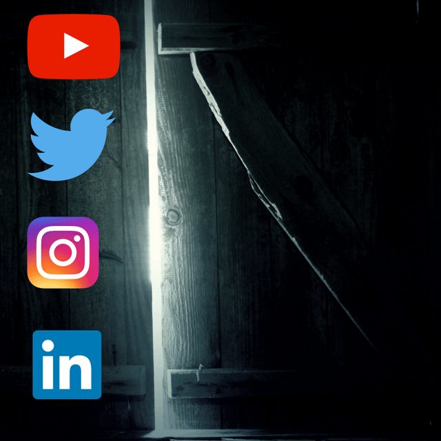 A dark room with social media logos