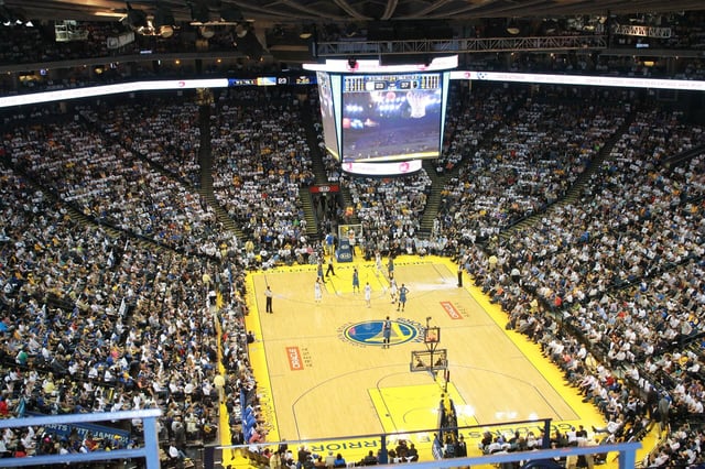 Photo of the Golden State Warriors playing in a crowded stadium