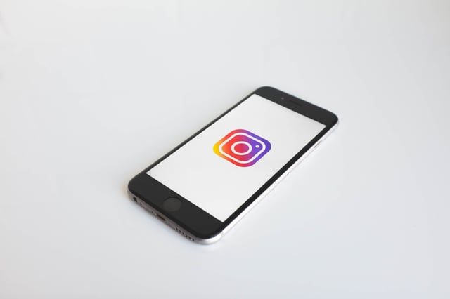 Cell phone displaying an Instagram logo